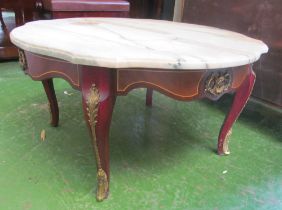 A circular marble top occasional table