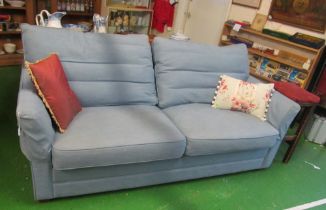 A blue three seater settee