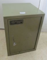 A green safe cabinet with key