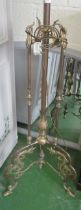 A brass floor standing lamp