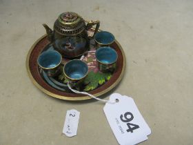 A cloisonné miniature teapot and four cups on tray