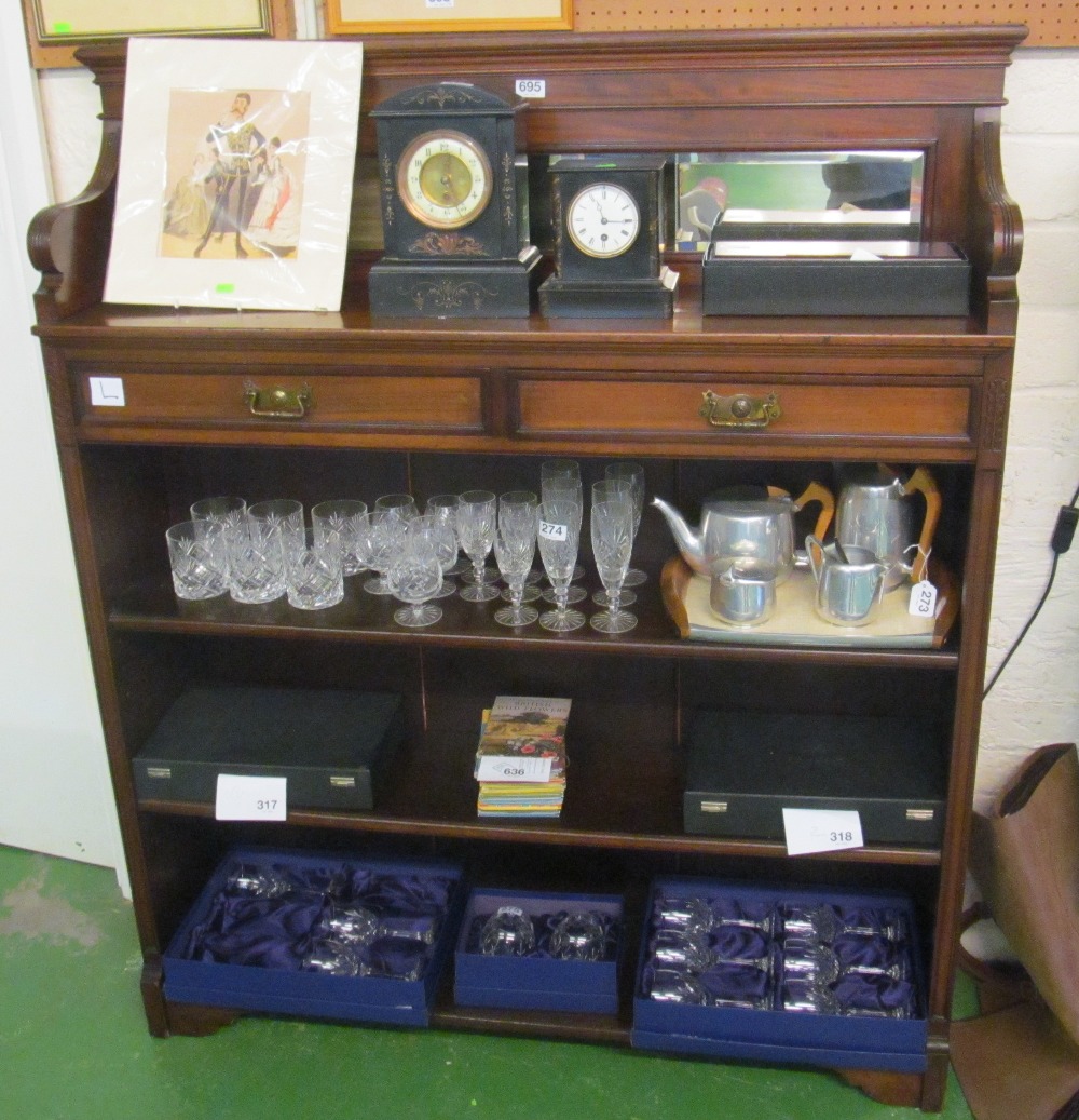 An Edwardian mahogany mirror back bookcase with two frieze drawers