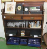 An Edwardian mahogany mirror back bookcase with two frieze drawers