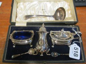 A Walker & Hall silver plated condiment set (i.c) and a plated ladle
