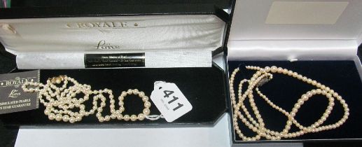 A double strand of pearls with marcasite clasp and a double strand of simulated pearls with silver