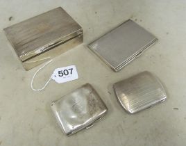 A silver cigarette box and three cases