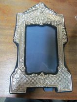 A tall silver photo frame