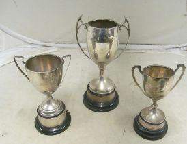 Three plain silver trophy cups