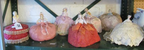 Seven Edwardian crinoline ladies with decorative skirts