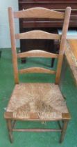 Four ladder back and rush seated chairs (a/f)