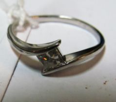 A platinum and solitaire diamond ring