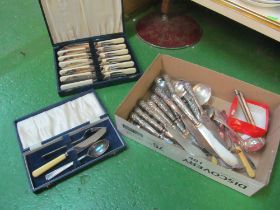 A silver sifter spoon, silver butter knife, plated cutlery, silver propelling pencil and another