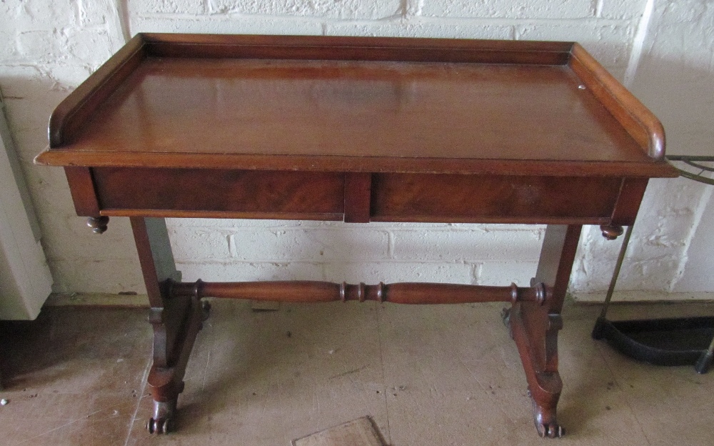 A mahogany side table desk two drawers and gallery