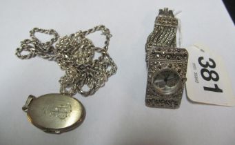 Two silver chains, a marcasite cocktail watch and a locket