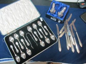 A set of twelve silver spoons and tongs (i.c), pair of silver salt and pepper and nine silver