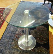 A small glass top table