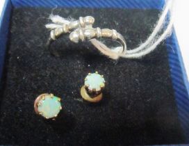 A pair of opal earrings and a silver ring