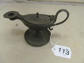A cast iron chamber stick in the form of an oil lamp Zimmerman Hanau to lid