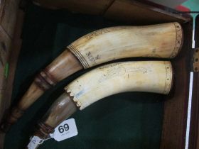 A pair of reproduction scrimshaw gunpowder horns