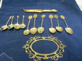 Four silver apostle spoons, pierced frame, paperknife dagger and six white metal spoons