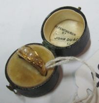 A Victorian gold coloured ring set graduated pearls 4.7g