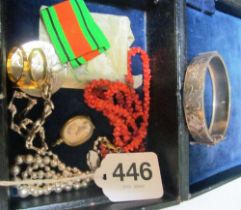 A silver bracelet, locket, silver bracelet, medal and two necklaces