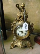 A 19th Century gilt clock with cherub surmount and with Ansonia Clock Co. movement
