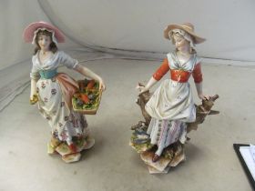 A pair of Volkstedt Rudolstadt porcelain figures and another pair (one a/f)