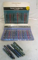 A Conway Stewart pen display cards with pens and seven Conway Stewart pens and pencils