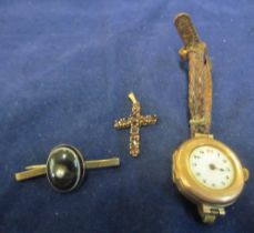 A 9ct gold watch, 9ct cross set red stones and an agate brooch