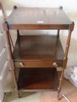 A three tier mahogany whatnot with drawer to centre tier