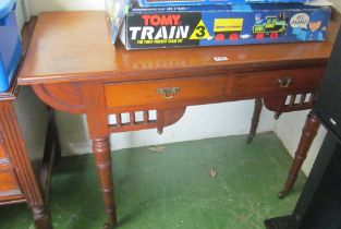 A mahogany two drawer side table