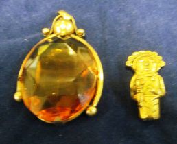 A pendant set orange stone and another figure pendant