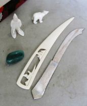 An Inuit bone polar bear, Eskimo, letter opener, stone and a knife