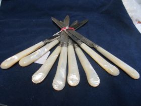 A set of eight mother of pearl handled knives, marked Cardeilhac