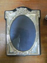 An oval silver photo frame