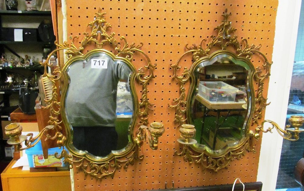 A pair of pretty brass mirrors with pierced floral frame and candle sconces