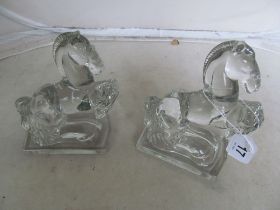 A pair of moulded glass horses