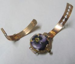 A Continental yellow metal watch marked 18k with enamel back and white stones