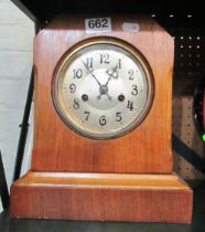 A walnut case mantel clock