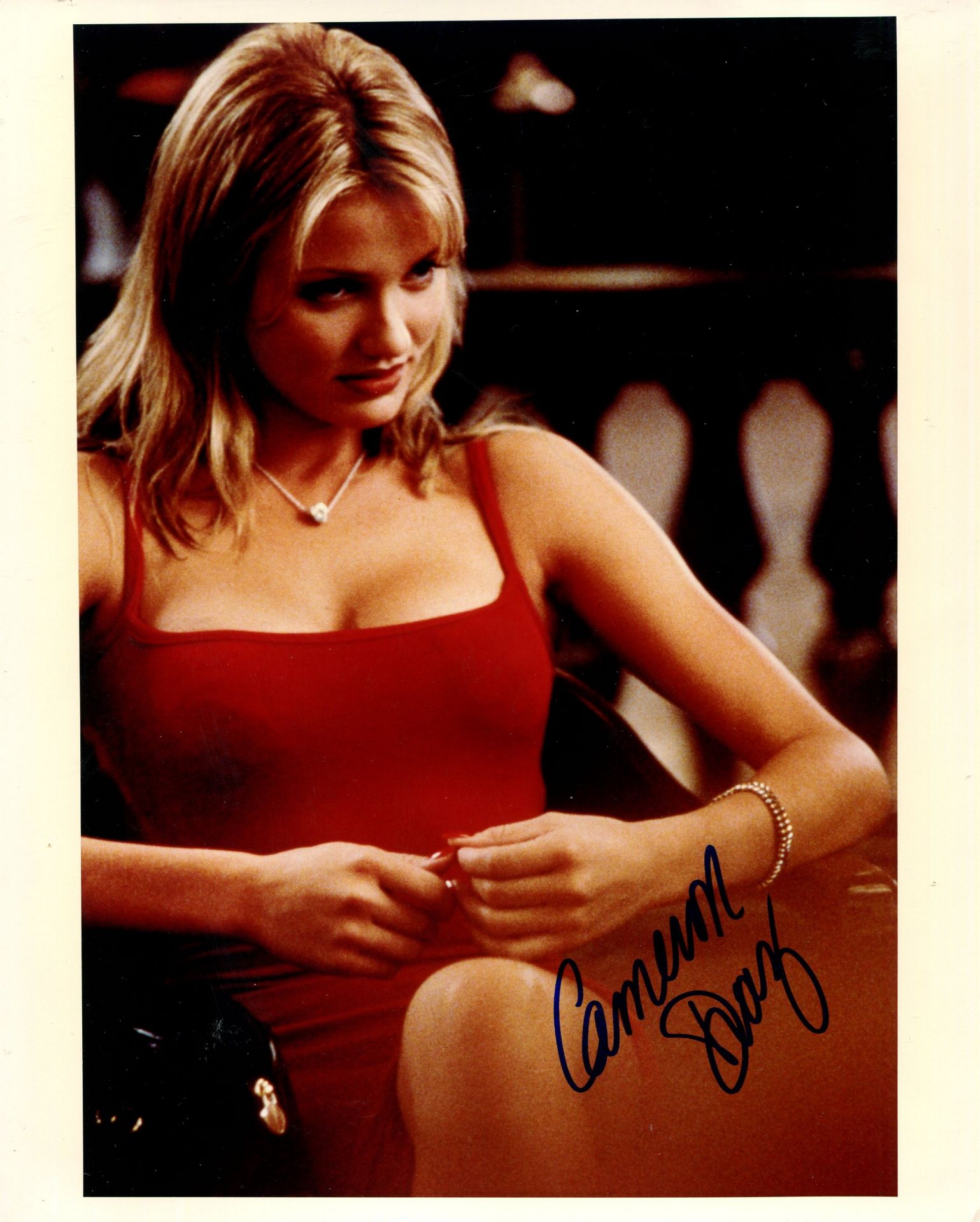 DIAZ CAMERON: (1972- ) American actress. Signed colour 8 x 10 photograph of Diaz seated in a three-