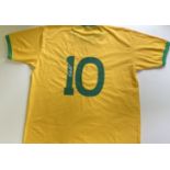 PELE: (1940-2022) Brazilian footballer. A replica short sleeved Brazil football jersey, yellow