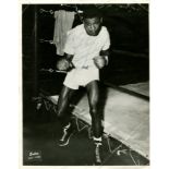 ROBINSON SUGAR RAY: (1921-1989) American boxer, World Welterweight Champion 1946-50, World