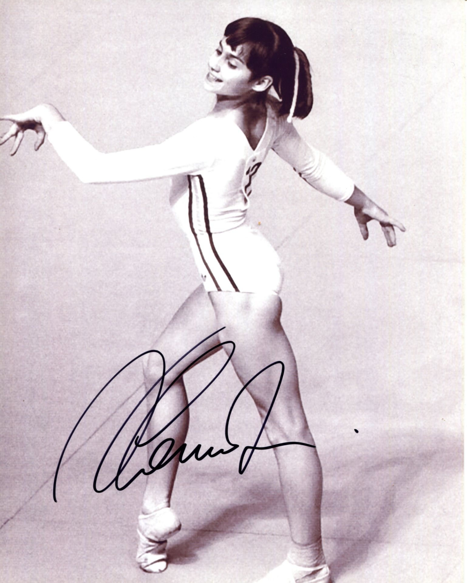 COMANECI NADIA: (1961- ) Romanian Gymnast. Five times Olympic individual gold medallist. Comaneci is