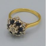 an 18ct gold diamond and Sapphire cluster ring, 4.1 grams, ring size J