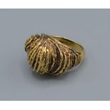 A 9ct gold heavy ring of scroll form, 12.2 grams, ring size M