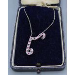 A white metal diamond and Ruby set pendant with fine linked chain and within blue velvet lined case