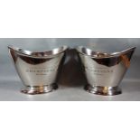 A pair of oval Champagne coolers, each with side handles and inscribed Cuvee Champagne, 26cms tall