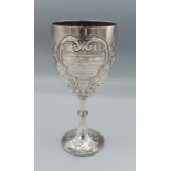 A Victorian silver presentation goblet embossed with foliate scrolls, London 1878, maker Frederick