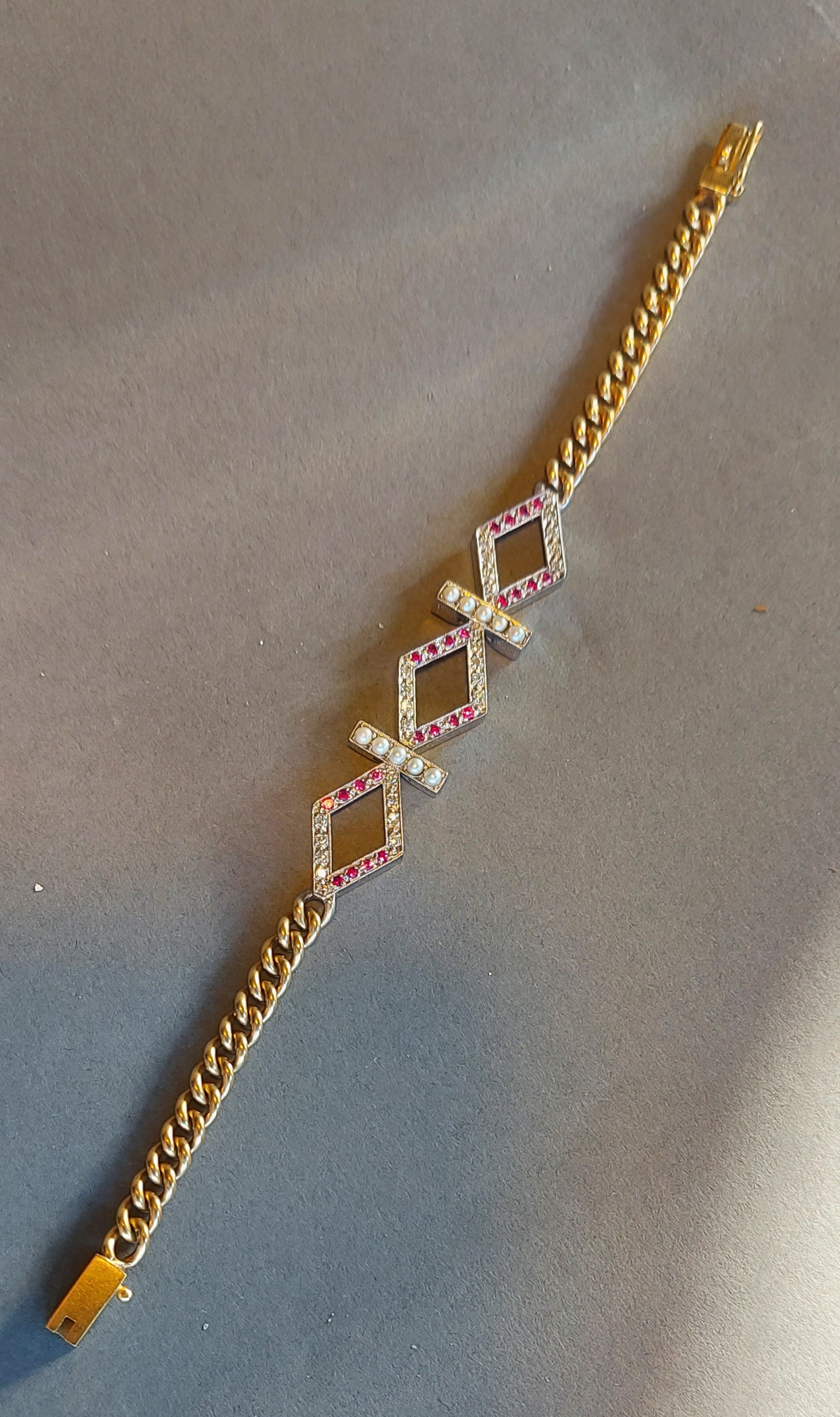 An 18ct white and yellow gold Pearl, Ruby and diamond set bracelet, with central lozenge interspaced
